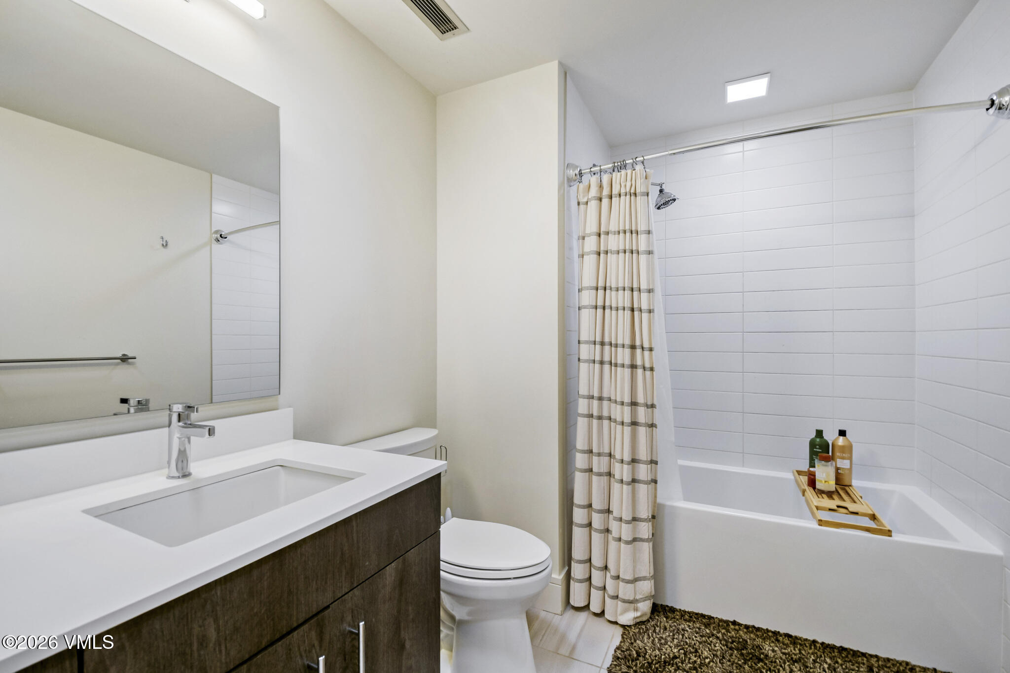 430 South Frontage Road East, Unit RUD Vail, CO 81657 - Photo 13 of 30 a bathroom with a sink toilet vanity and shower