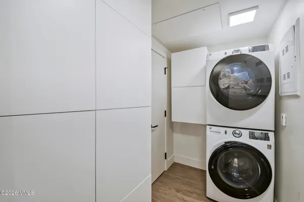 a view of a chairs and table in the balcony