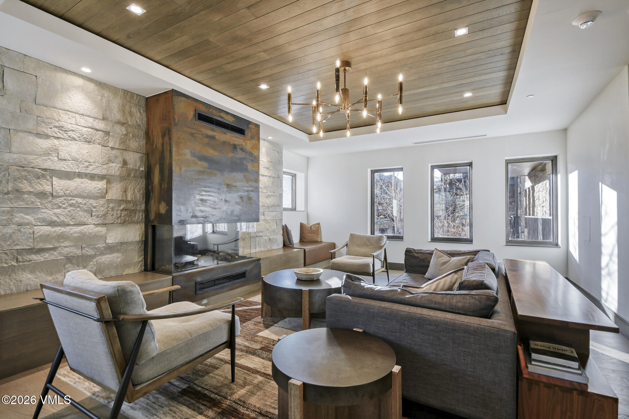 430 South Frontage Road East, Unit RUD Vail, CO 81657 - Photo 18 of 30 a living room with furniture and a chandelier