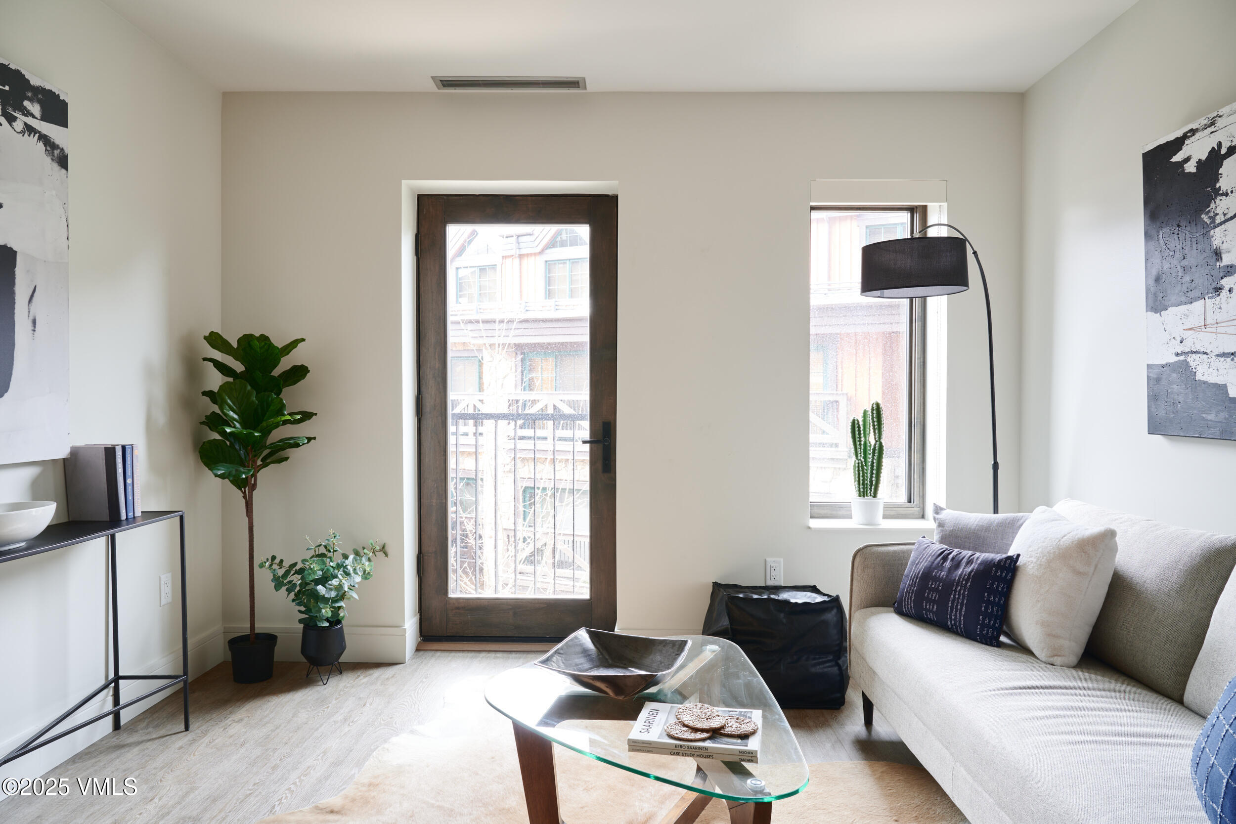 430 South Frontage Road East, Unit RUD Vail, CO 81657 - Photo 4 of 8 a living room with furniture and potted plants