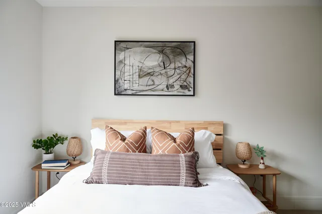 a en suite bathroom with a granite countertop sink and a mirror