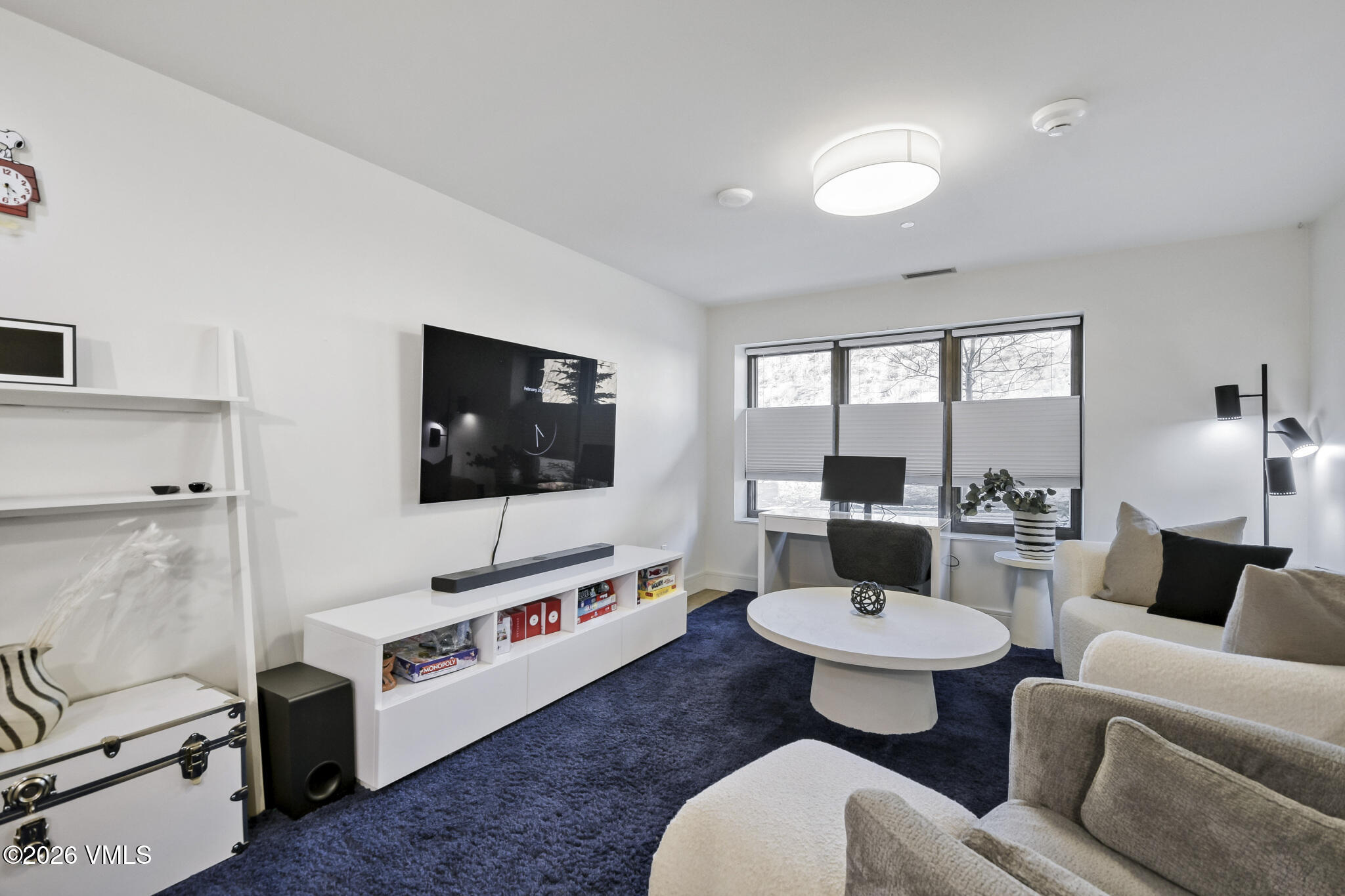 430 South Frontage Road East, Unit RUD Vail, CO 81657 - Photo 5 of 30 a living room with furniture and a flat screen tv