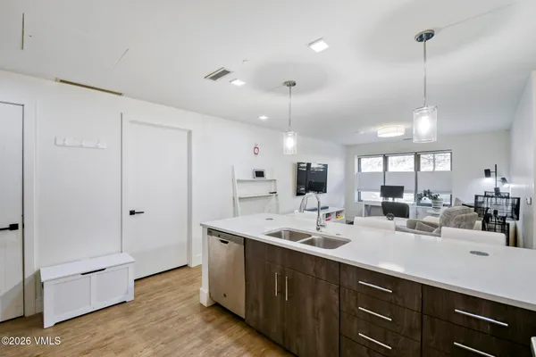 a bedroom with a bed and a potted plant