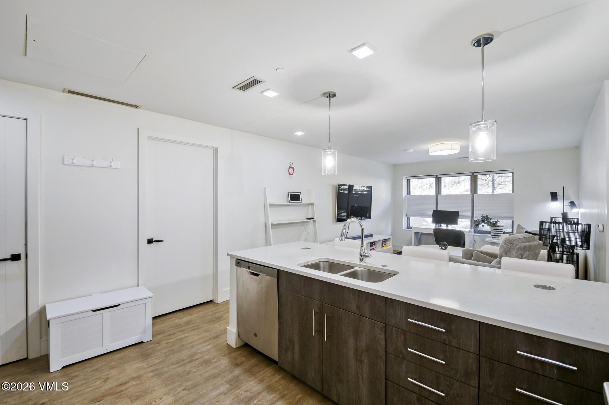 430 South Frontage Road East, Unit RUD Vail, CO 81657 - Photo 6 of 30 a kitchen with kitchen island a sink appliances and cabinets