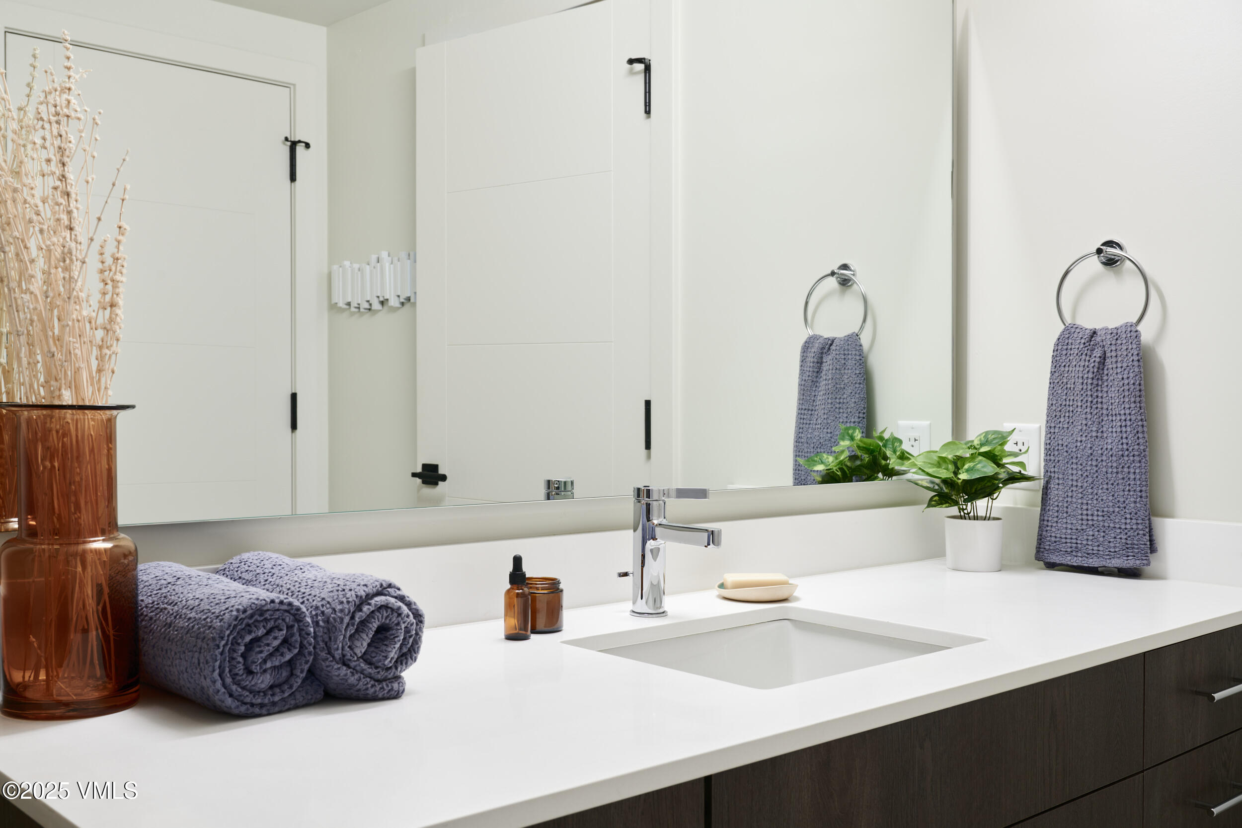 430 South Frontage Road East, Unit RUD Vail, CO 81657 - Photo 7 of 8 a bathroom with a sink and a mirror