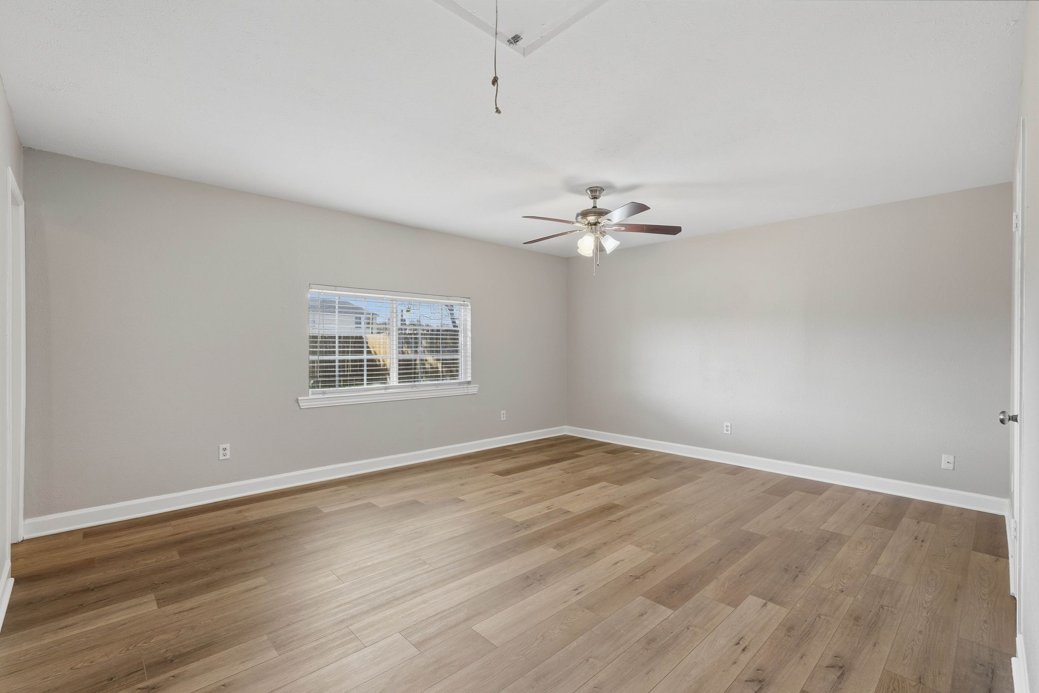 17223 Ranch Country Road Hockley, TX 77447 - Photo 25 of 36 Next up is your primary bedroom with tons of space to have a king sized bed, dressers, and whatever else you choose to make this home your own.