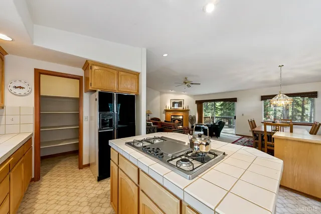 a kitchen with a sink and a large window