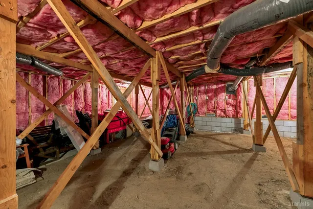 a view of a house with wooden deck