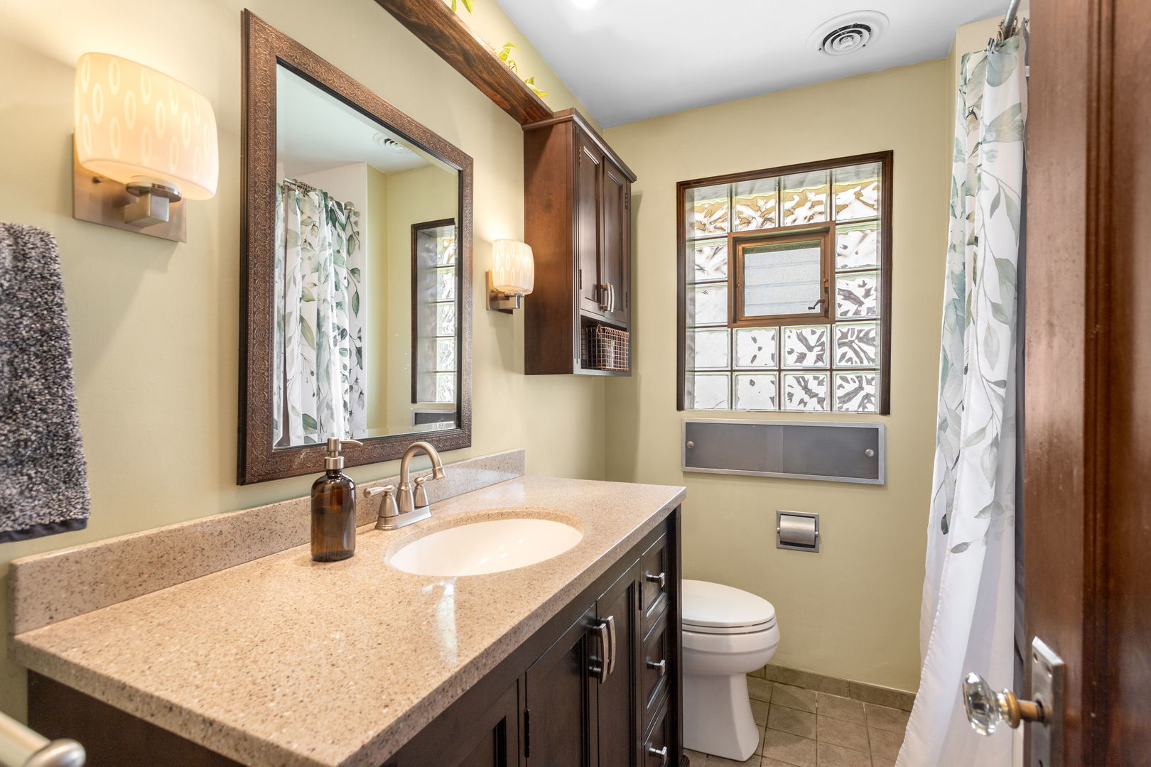 342 Lawton Road Riverside, IL 60546 - Photo 12 of 33 a bathroom with a granite countertop sink toilet and mirror