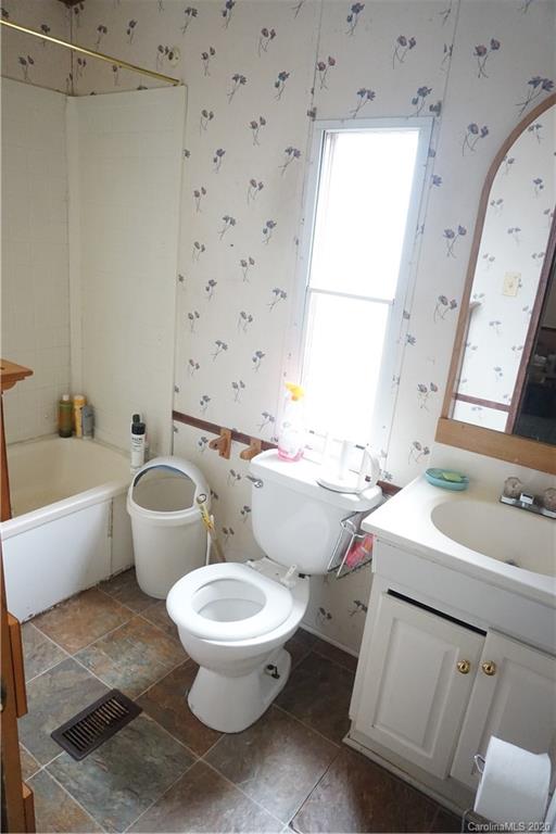 155 Leaning Tree Road Lugoff, SC 29078 - Photo 14 of 28 a bathroom with a sink toilet vanity and tub
