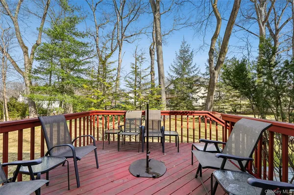 a view of a chairs and table on the deck