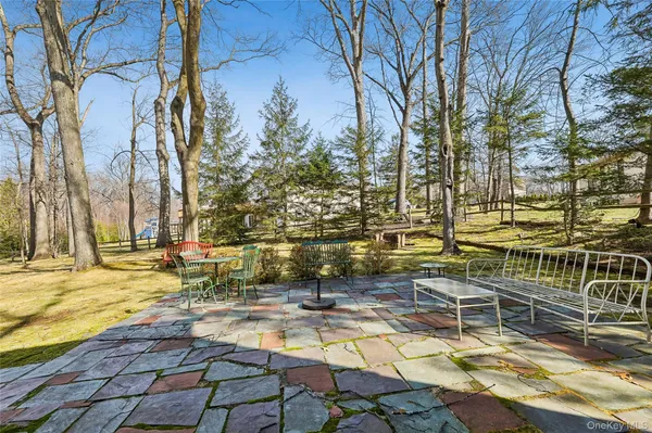 a view of yard with patio