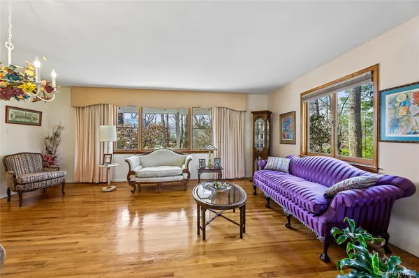 a living room with furniture or couch and a large window