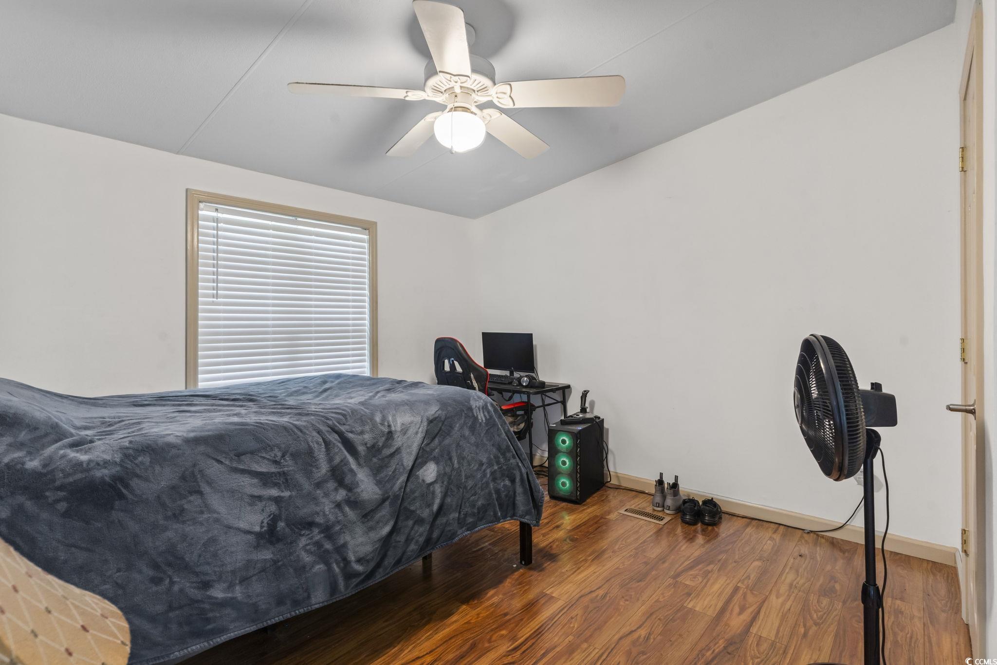 1585 Daisy Road Loris, SC 29569 - Photo 30 of 48 Bedroom featuring wood finished floors and a ceiling fan
