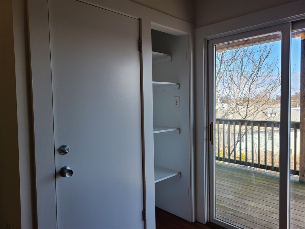 27 Buttonwood Street, Unit 3 Boston, MA 02125 - Photo 21 of 22 a view of hallway with wooden floor