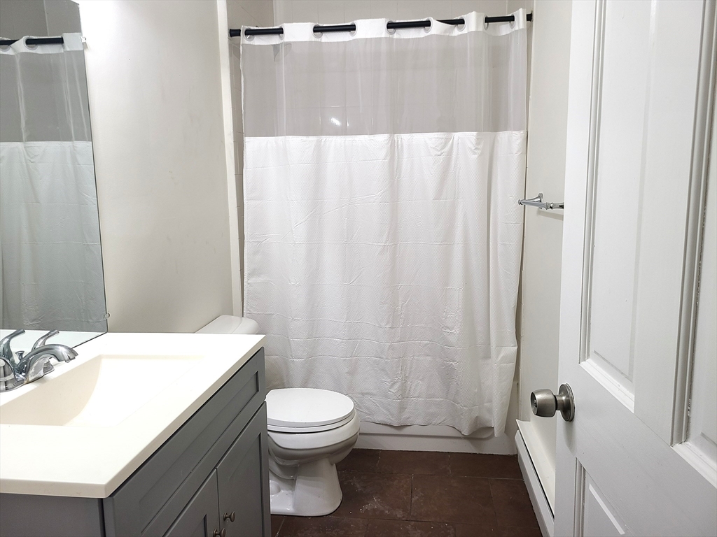 27 Buttonwood Street, Unit 3 Boston, MA 02125 - Photo 22 of 22 a bathroom with a white toilet and sink