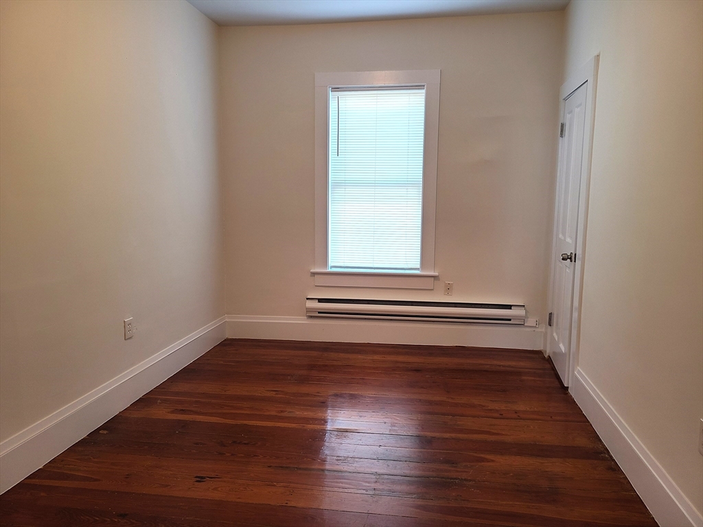 27 Buttonwood Street, Unit 3 Boston, MA 02125 - Photo 7 of 22 a view of a room with wooden floors and window