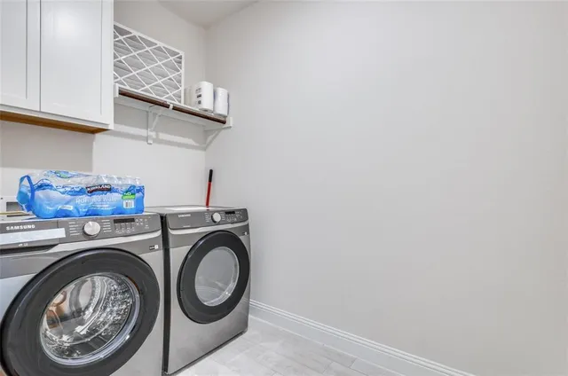 a utility room with dryer and washer