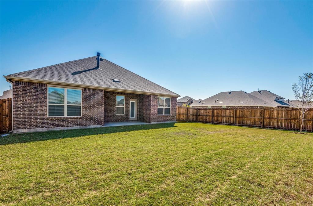 3205 Platinum Road Aubrey, TX 76227 - Photo 25 of 25 a view of a house next to a big yard