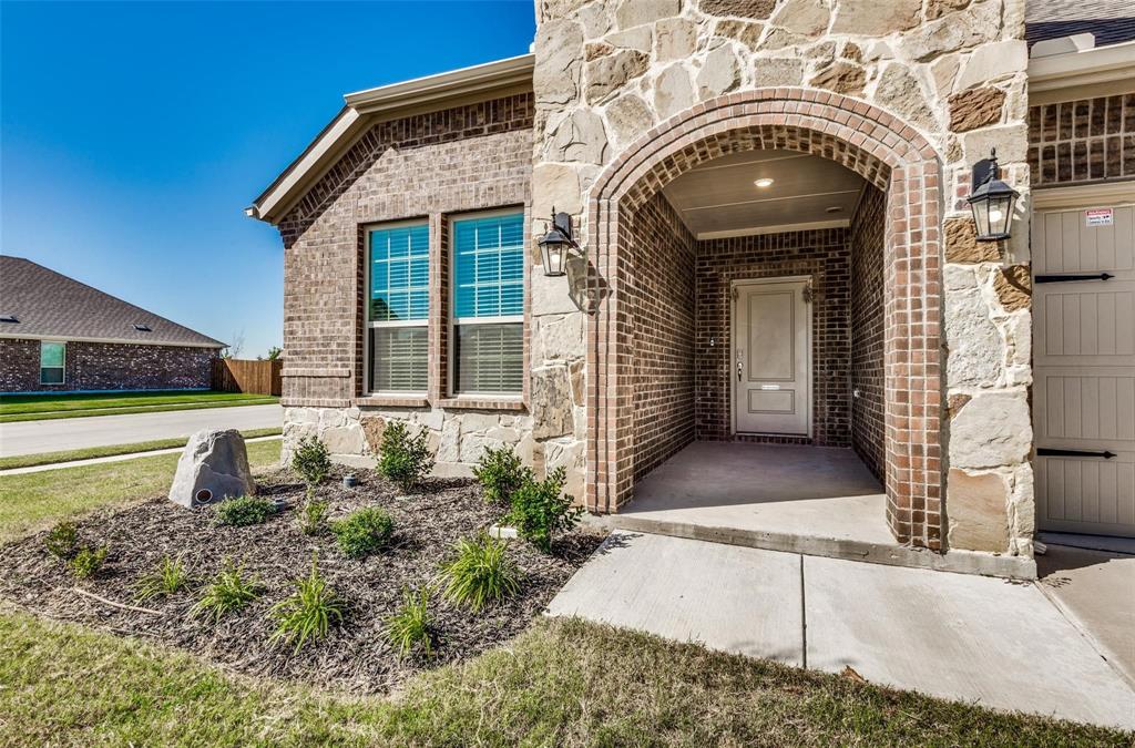 3205 Platinum Road Aubrey, TX 76227 - Photo 4 of 25 a front view of a house with garden