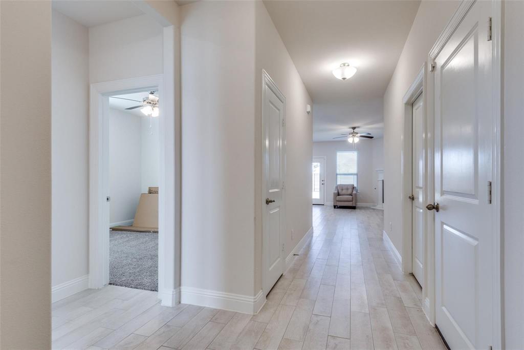 3205 Platinum Road Aubrey, TX 76227 - Photo 6 of 25 a view of a room with wooden floor