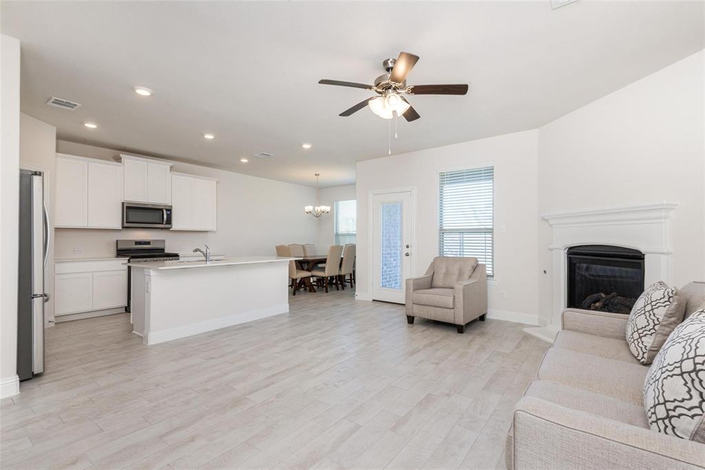 3205 Platinum Road Aubrey, TX 76227 - Photo 7 of 25 a living room with furniture and kitchen view