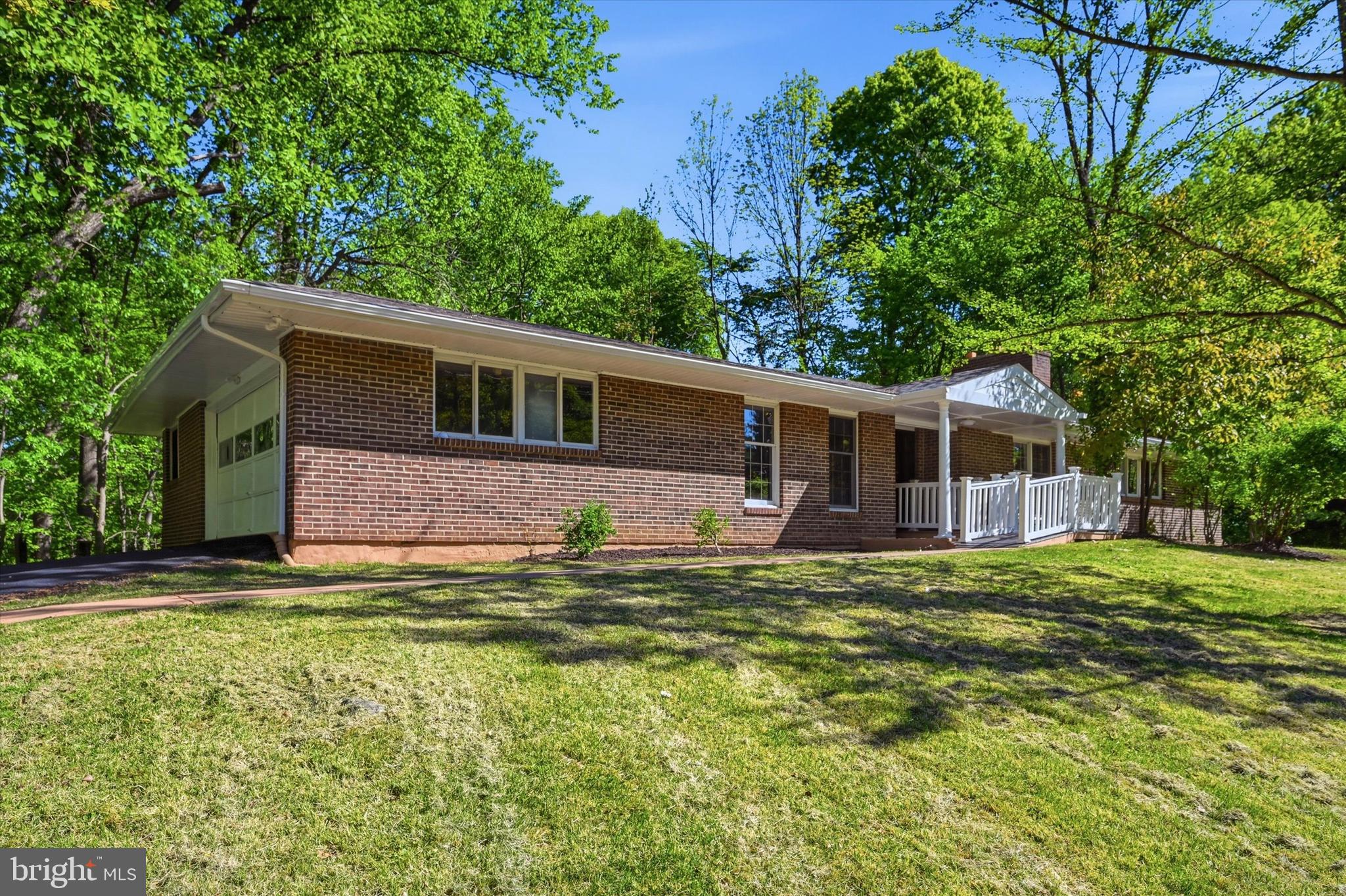 103 Baynard Boulevard Wilmington, DE 19803 - Photo 1 of 35 a front view of a house with a garden