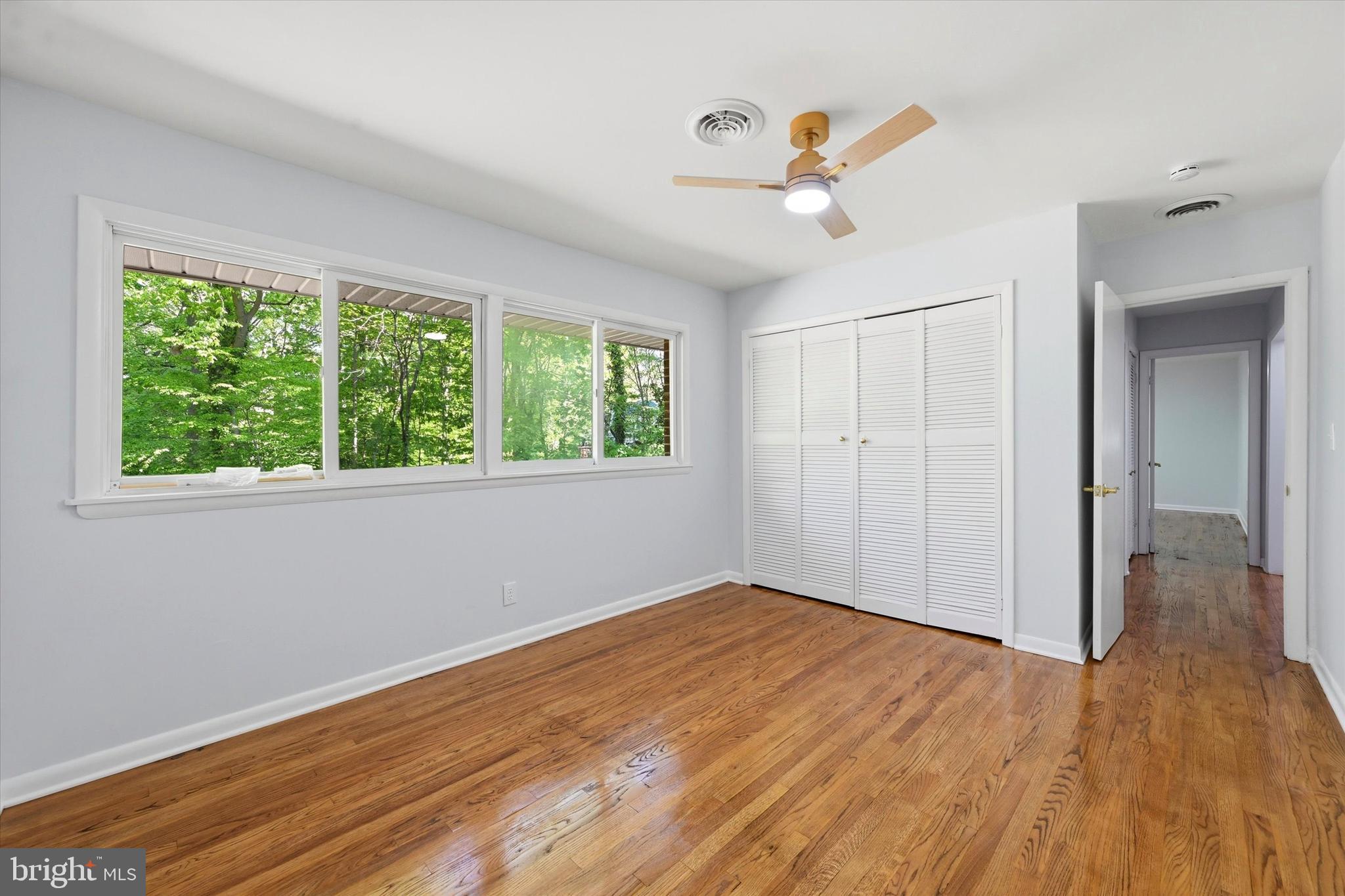 103 Baynard Boulevard Wilmington, DE 19803 - Photo 18 of 35 an empty room with wooden floor fan and windows