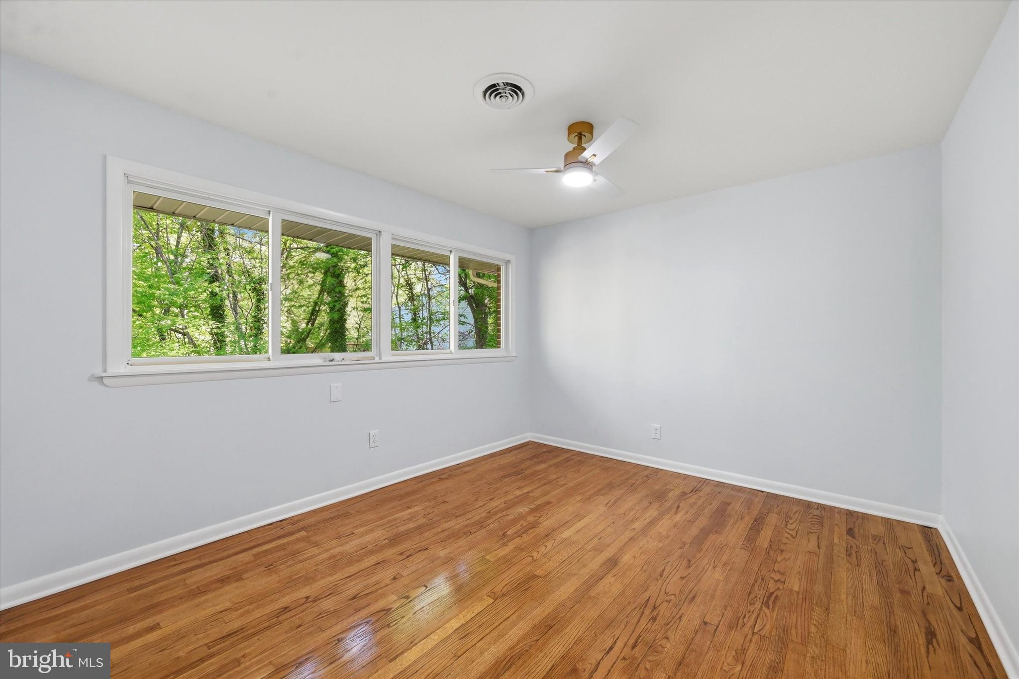 103 Baynard Boulevard Wilmington, DE 19803 - Photo 19 of 35 wooden floor in an empty room with a window