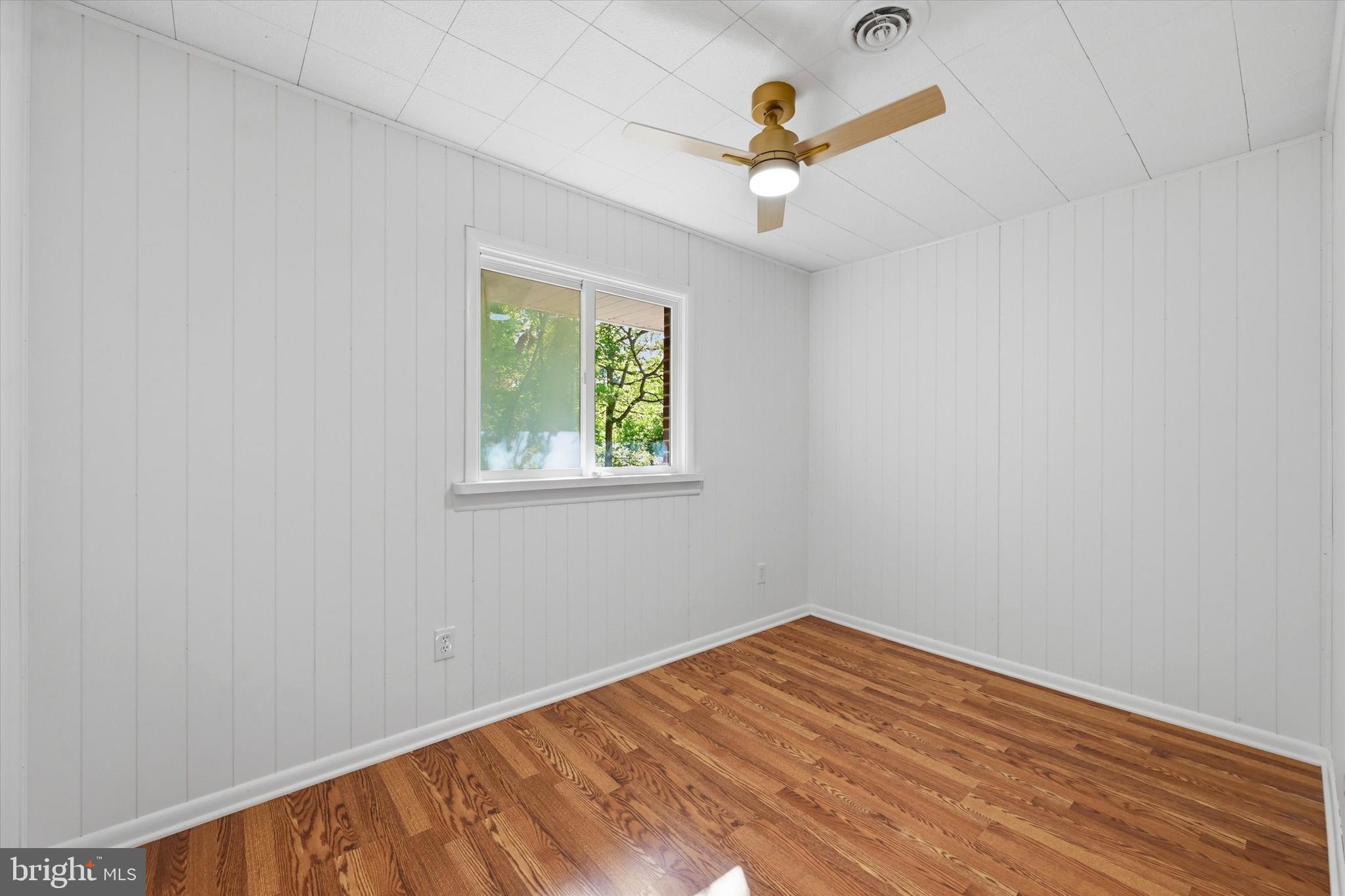 103 Baynard Boulevard Wilmington, DE 19803 - Photo 23 of 35 an empty room with a window and ceiling fan