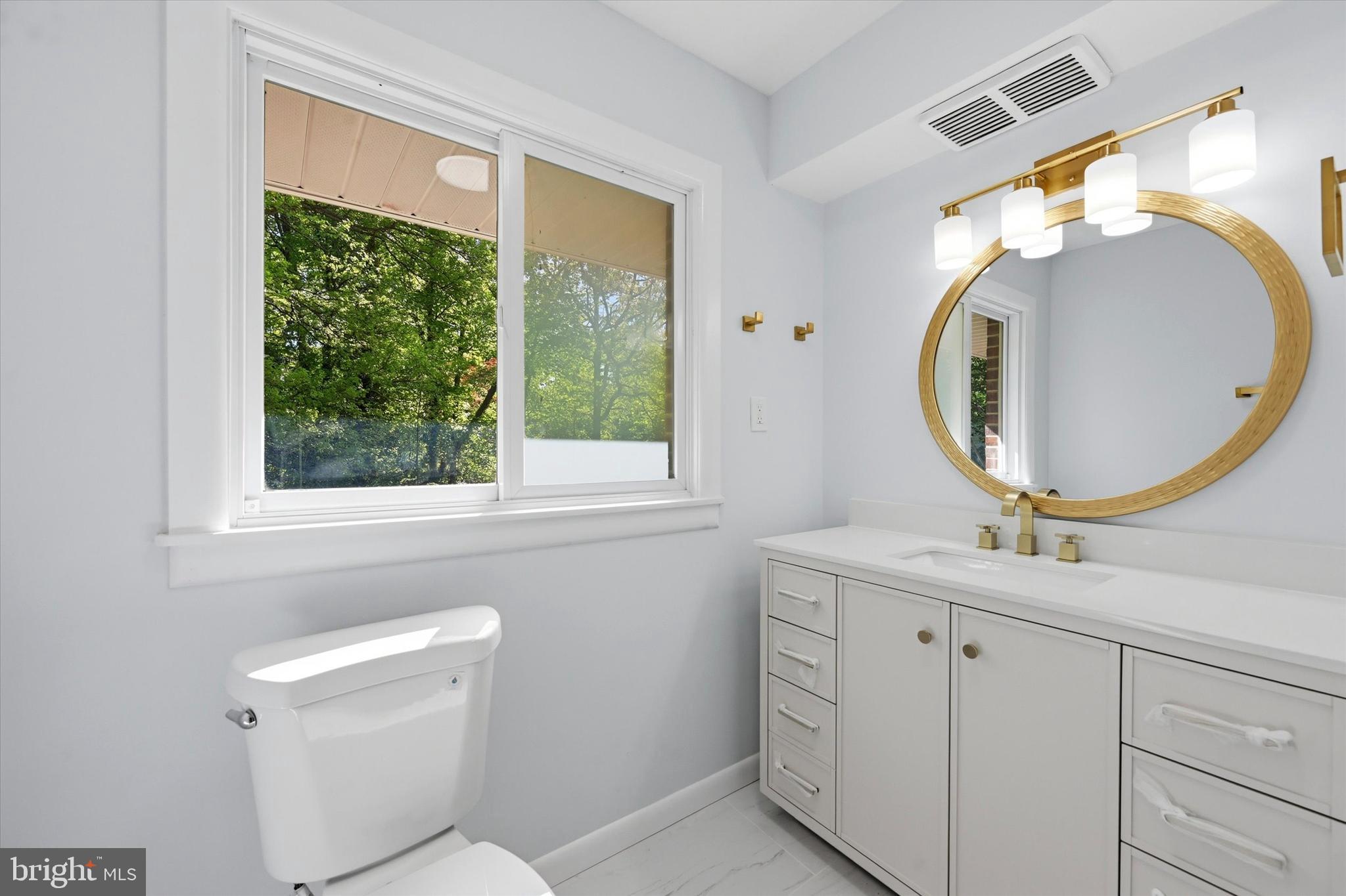 103 Baynard Boulevard Wilmington, DE 19803 - Photo 27 of 35 a bathroom with a toilet mirror vanity and a sink