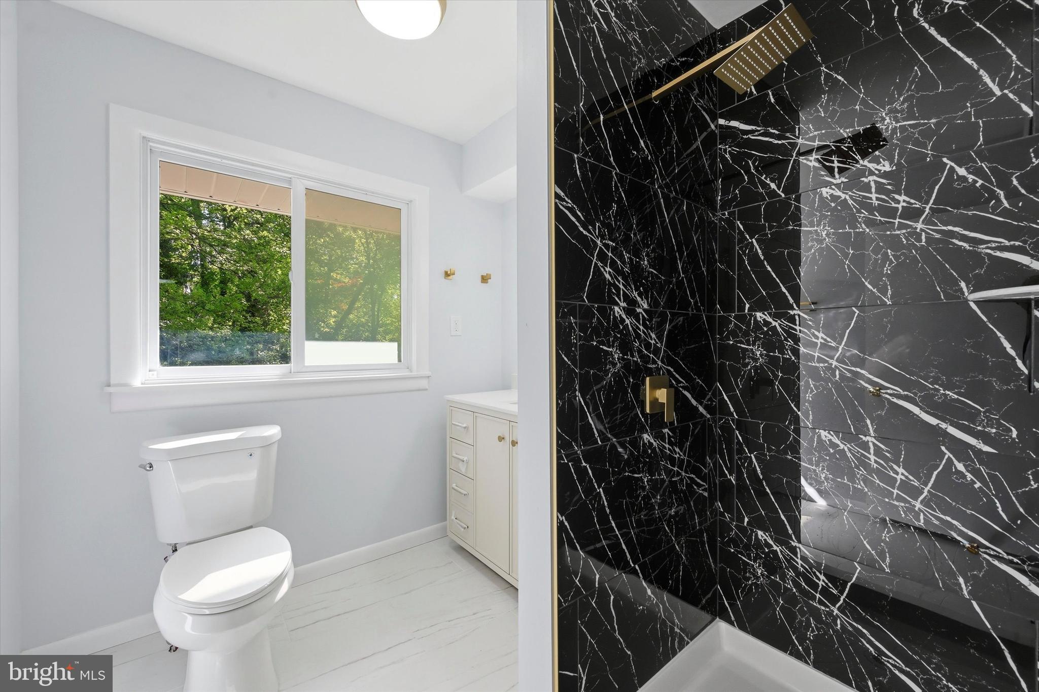 103 Baynard Boulevard Wilmington, DE 19803 - Photo 28 of 35 a bathroom with a toilet and a shower