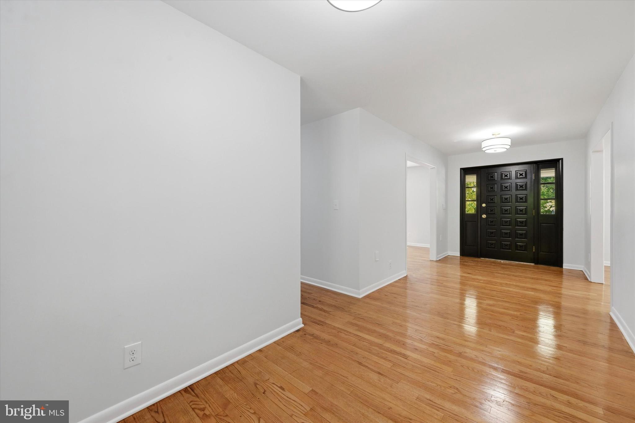 103 Baynard Boulevard Wilmington, DE 19803 - Photo 5 of 35 a view of an empty room with wooden floor and a window