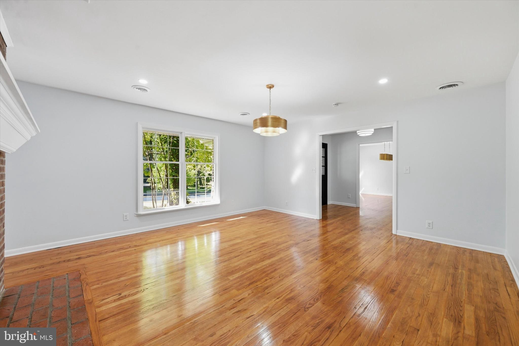 103 Baynard Boulevard Wilmington, DE 19803 - Photo 7 of 35 a view of an empty room with wooden floor and a window