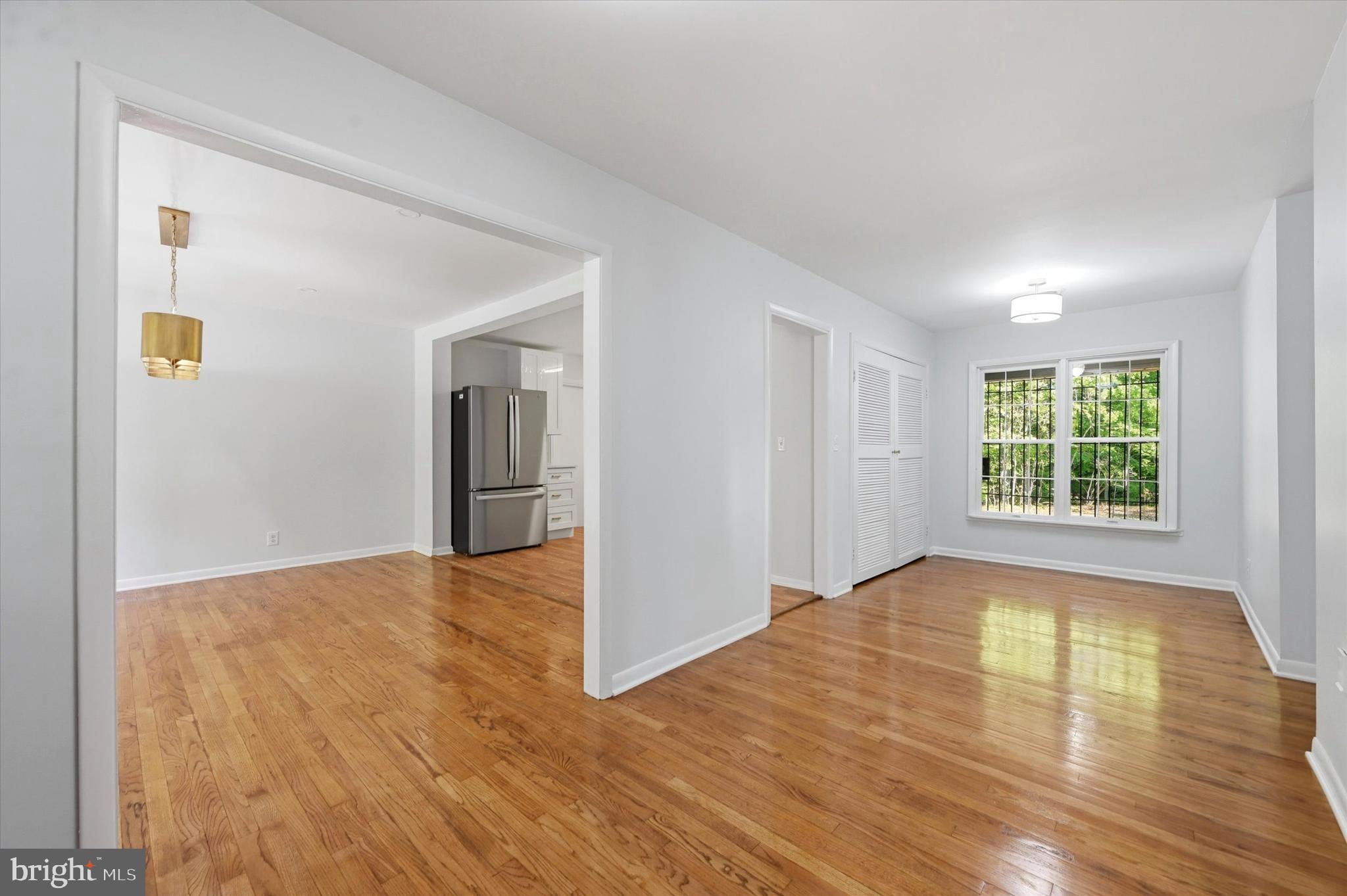 103 Baynard Boulevard Wilmington, DE 19803 - Photo 8 of 35 a view of an empty room with wooden floor and a window