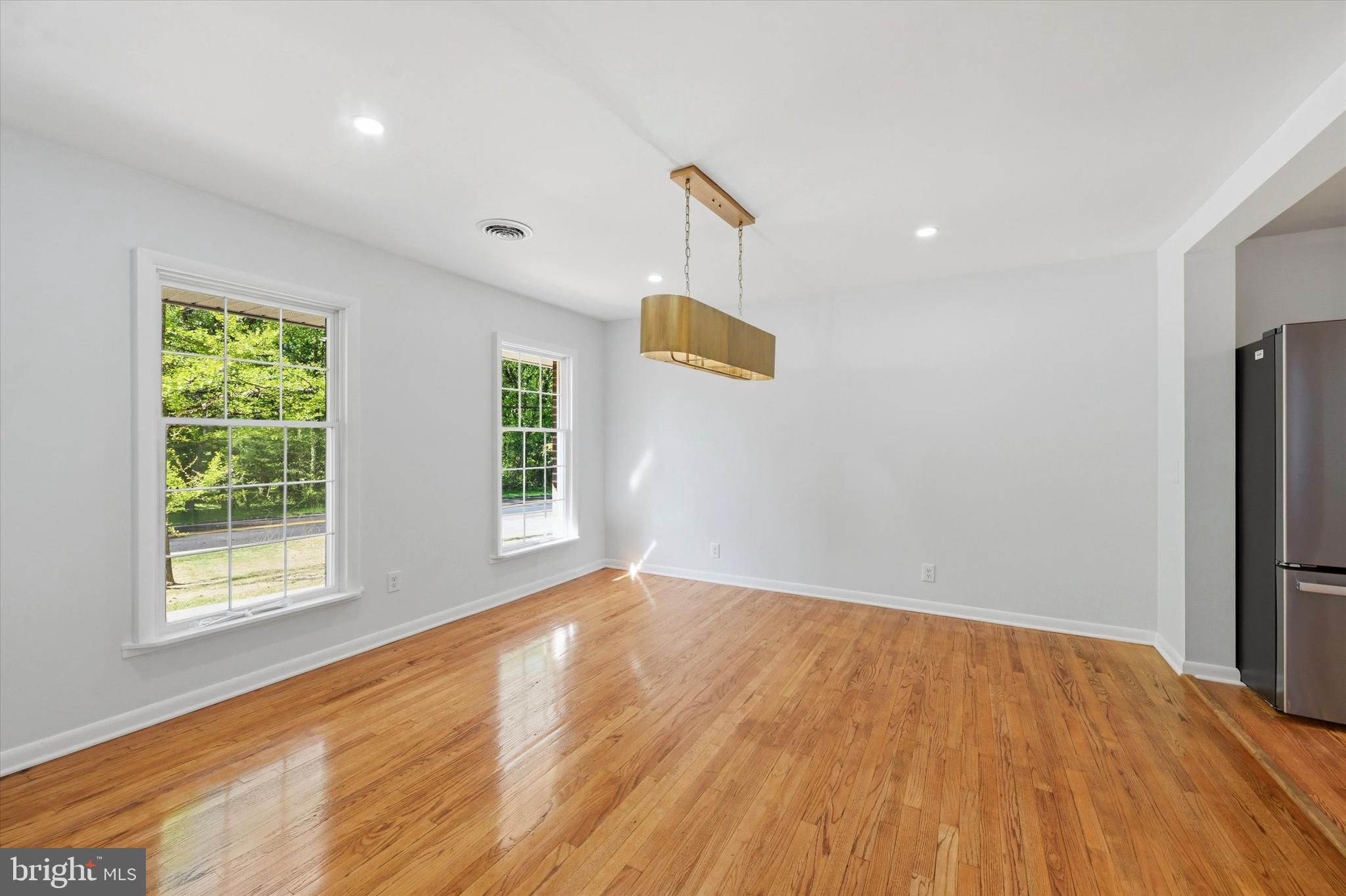 103 Baynard Boulevard Wilmington, DE 19803 - Photo 9 of 35 a view of an empty room with wooden floor and a window