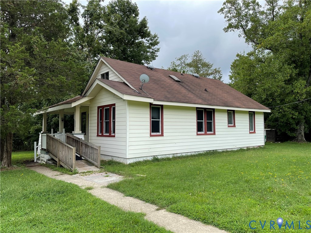 a aerial view of a house with a yard