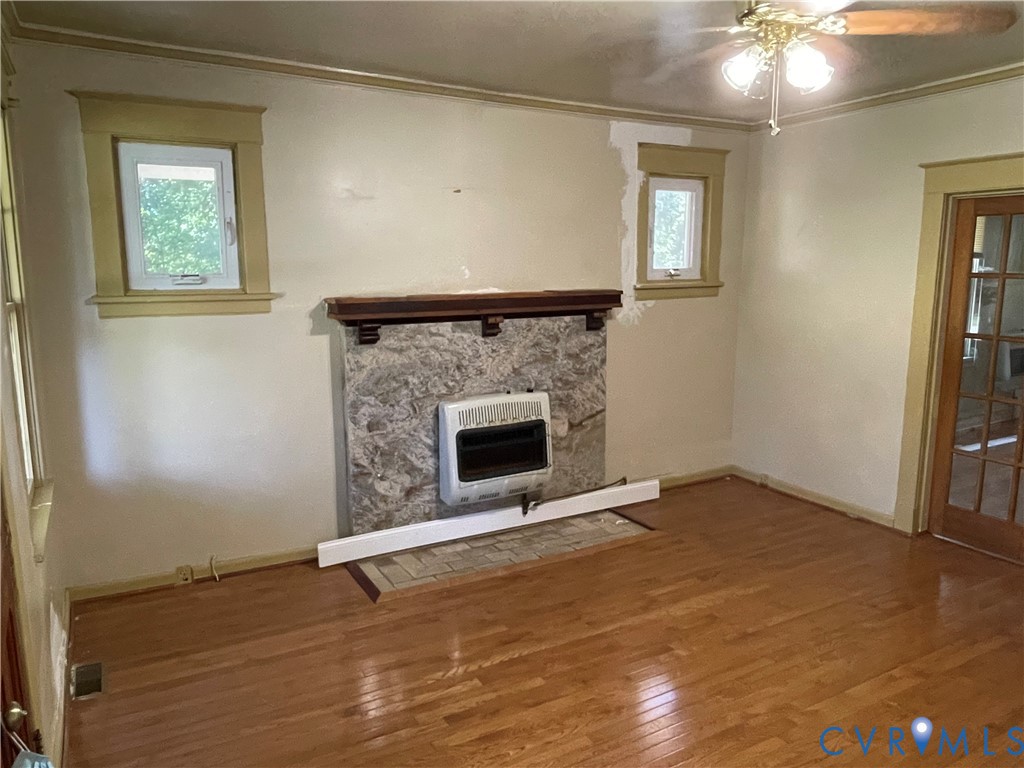 4667 Bell Road Powhatan, VA 23139 - Photo 2 of 10 an empty room with windows and fireplace