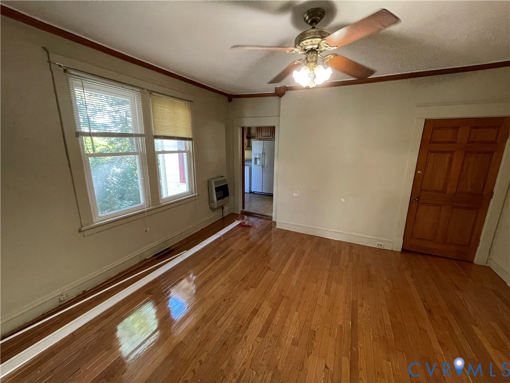 4667 Bell Road Powhatan, VA 23139 - Photo 5 of 10 wooden floor in an empty room with a window