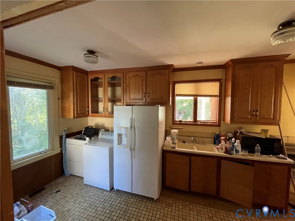 4667 Bell Road Powhatan, VA 23139 - Photo 8 of 10 a kitchen with a refrigerator and a sink