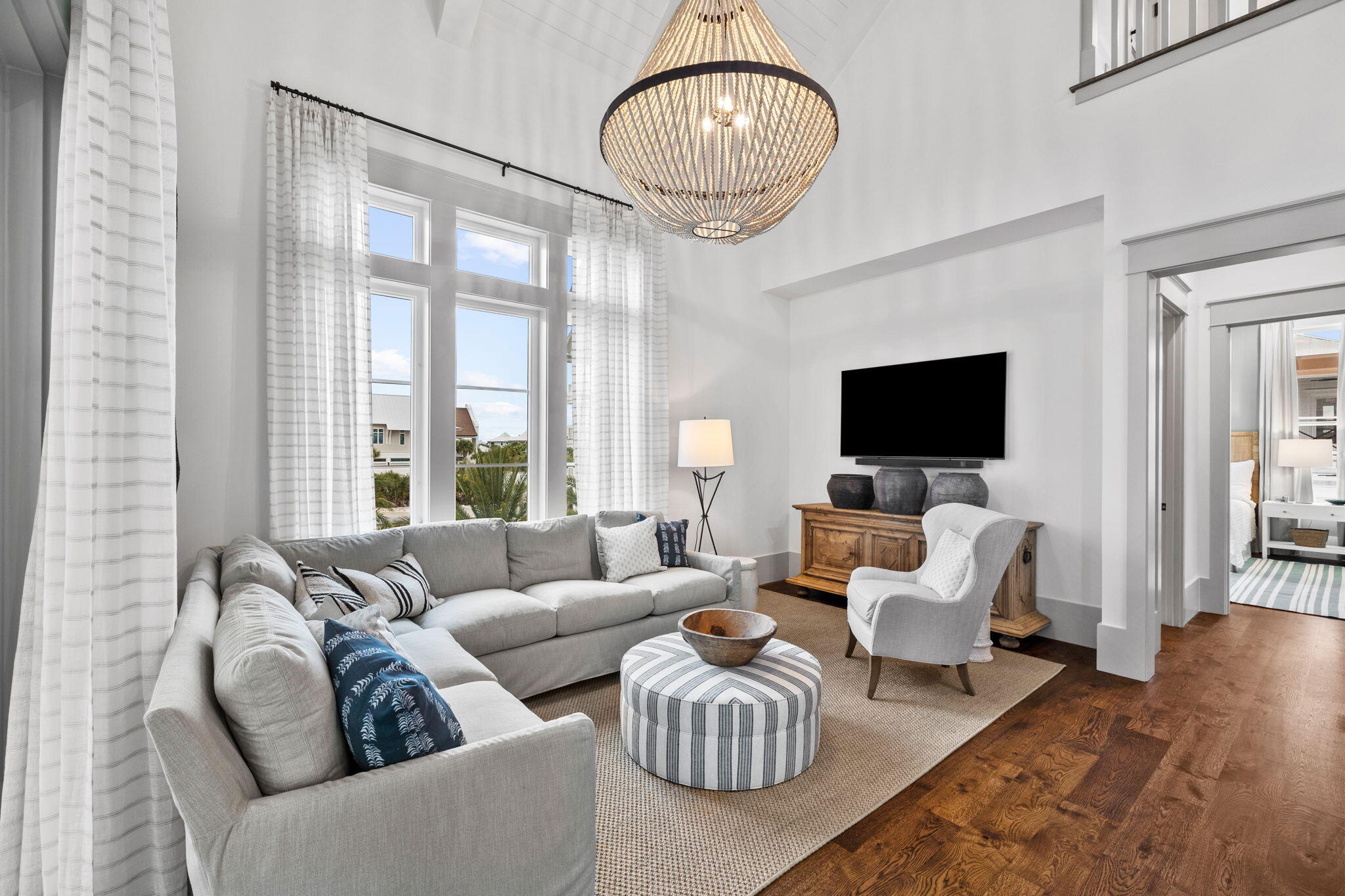 71 Chivas Lane Santa Rosa Beach, FL 32459 - Photo 116 of 128 a living room with furniture a flat screen tv and a large window