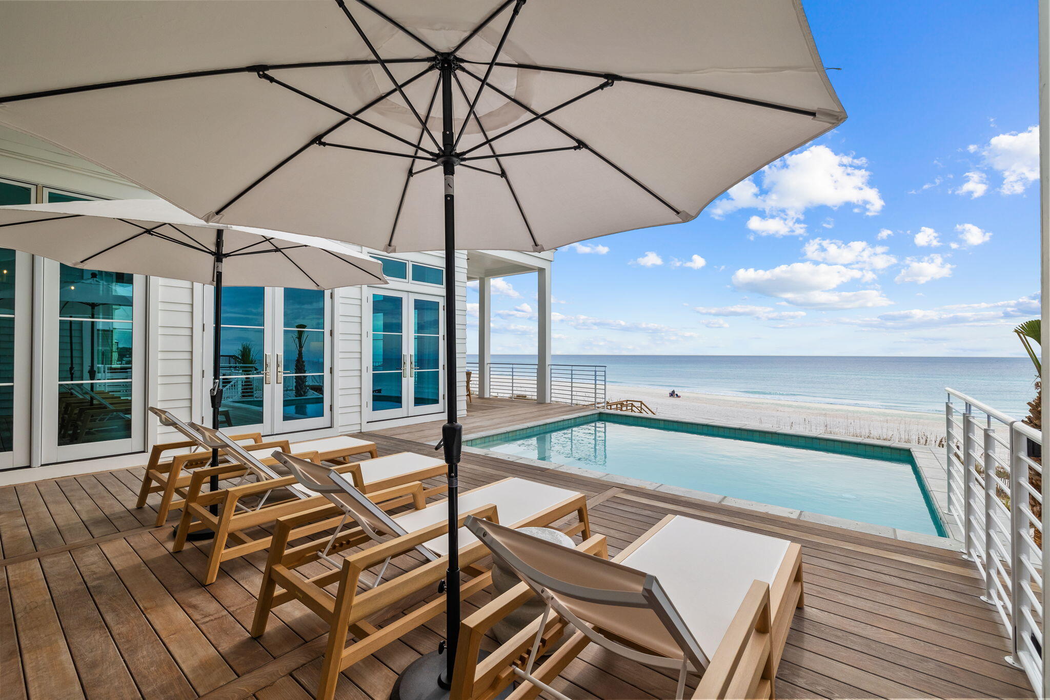 71 Chivas Lane Santa Rosa Beach, FL 32459 - Photo 21 of 128 a view of a patio with a table and chairs under an umbrella