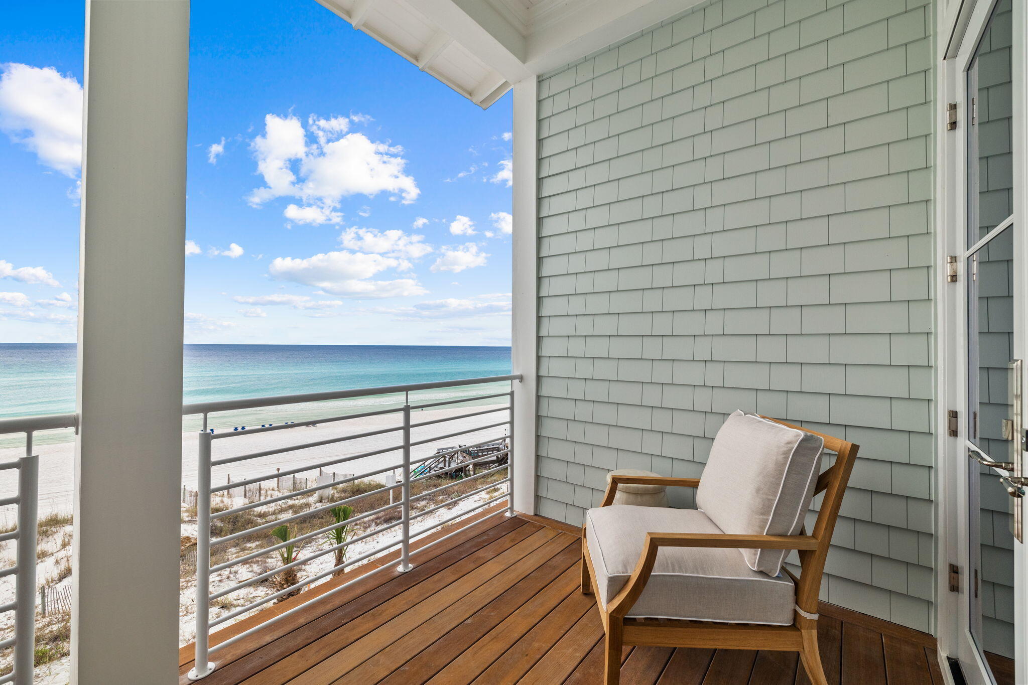 71 Chivas Lane Santa Rosa Beach, FL 32459 - Photo 86 of 128 a view of a balcony with a dining table and chairs with wooden floor
