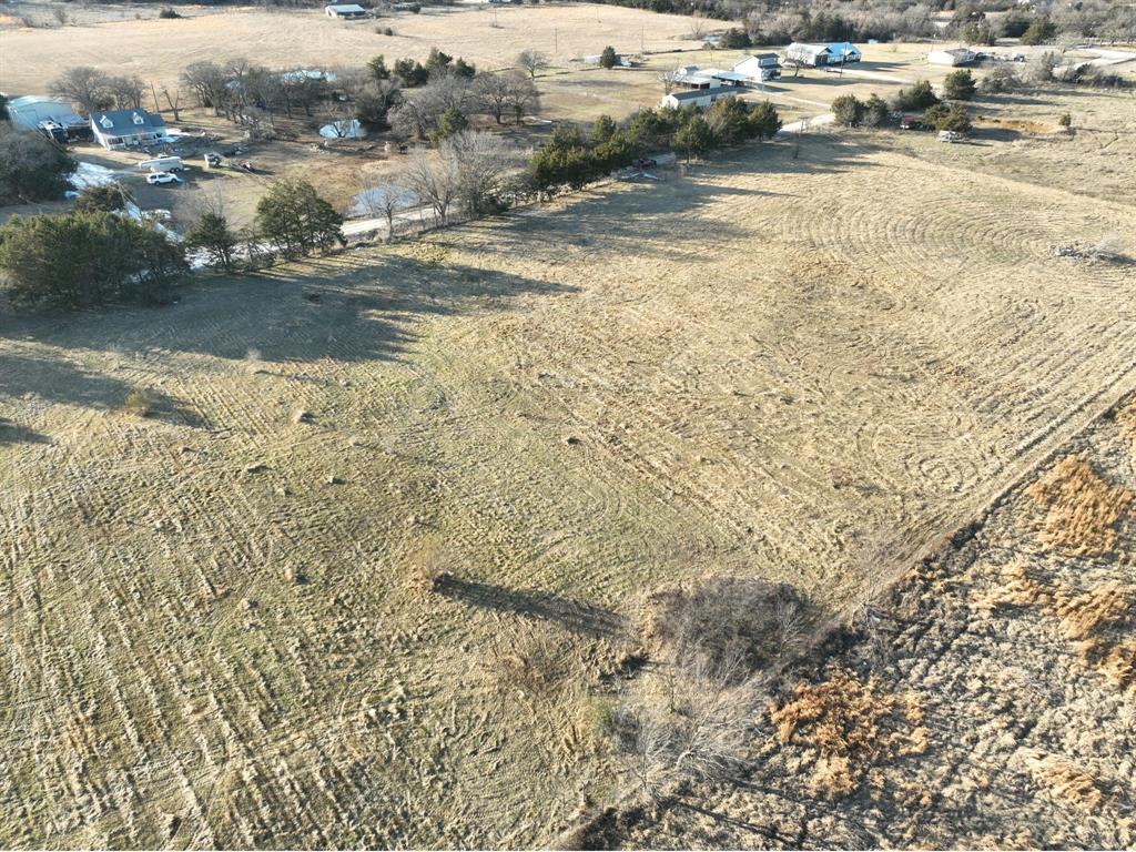 200 The Oil Road Gainesville, TX 76240 - Photo 4 of 6 Expansive land parcel with partial fencing and varying ground cover