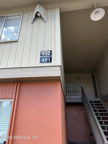 a view of an entryway with a kitchen