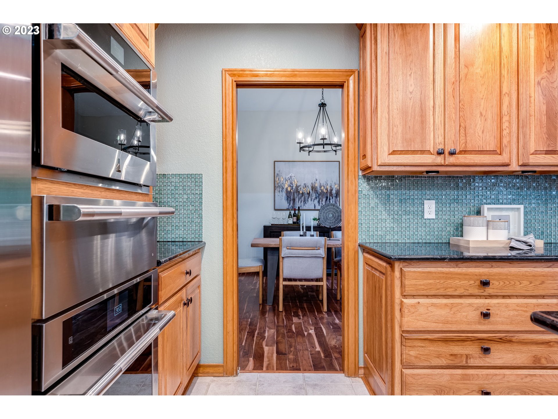3200 Northeast Jackson Rd Loop Hillsboro, OR 97124 - Photo 13 of 37 a kitchen with a refrigerator and a stove top oven