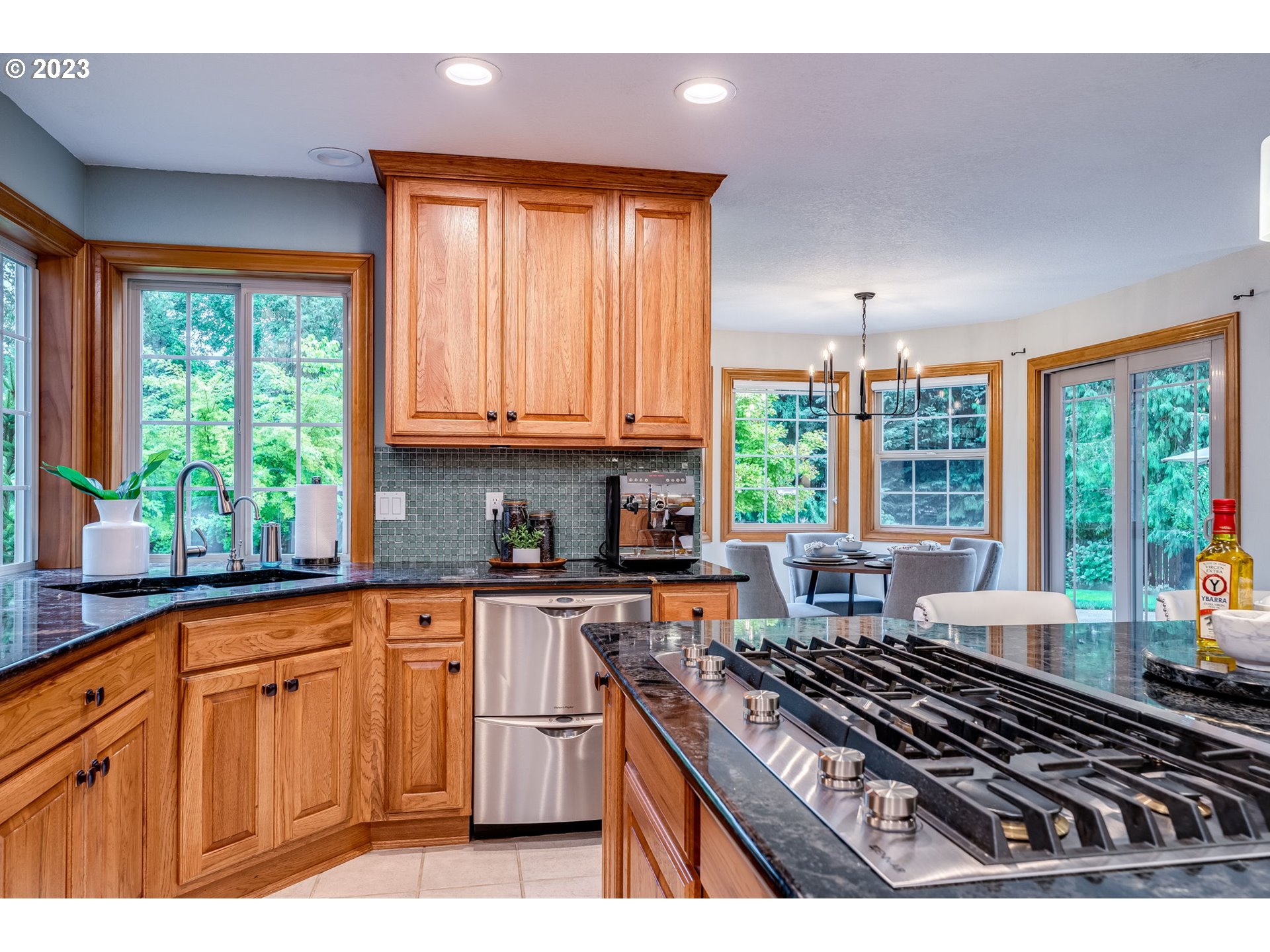 3200 Northeast Jackson Rd Loop Hillsboro, OR 97124 - Photo 15 of 37 a kitchen with sink a stove and cabinets