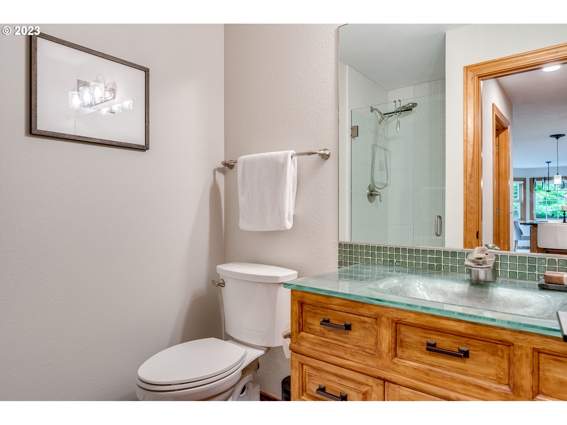 3200 Northeast Jackson Rd Loop Hillsboro, OR 97124 - Photo 22 of 37 a bathroom with a toilet sink and mirror