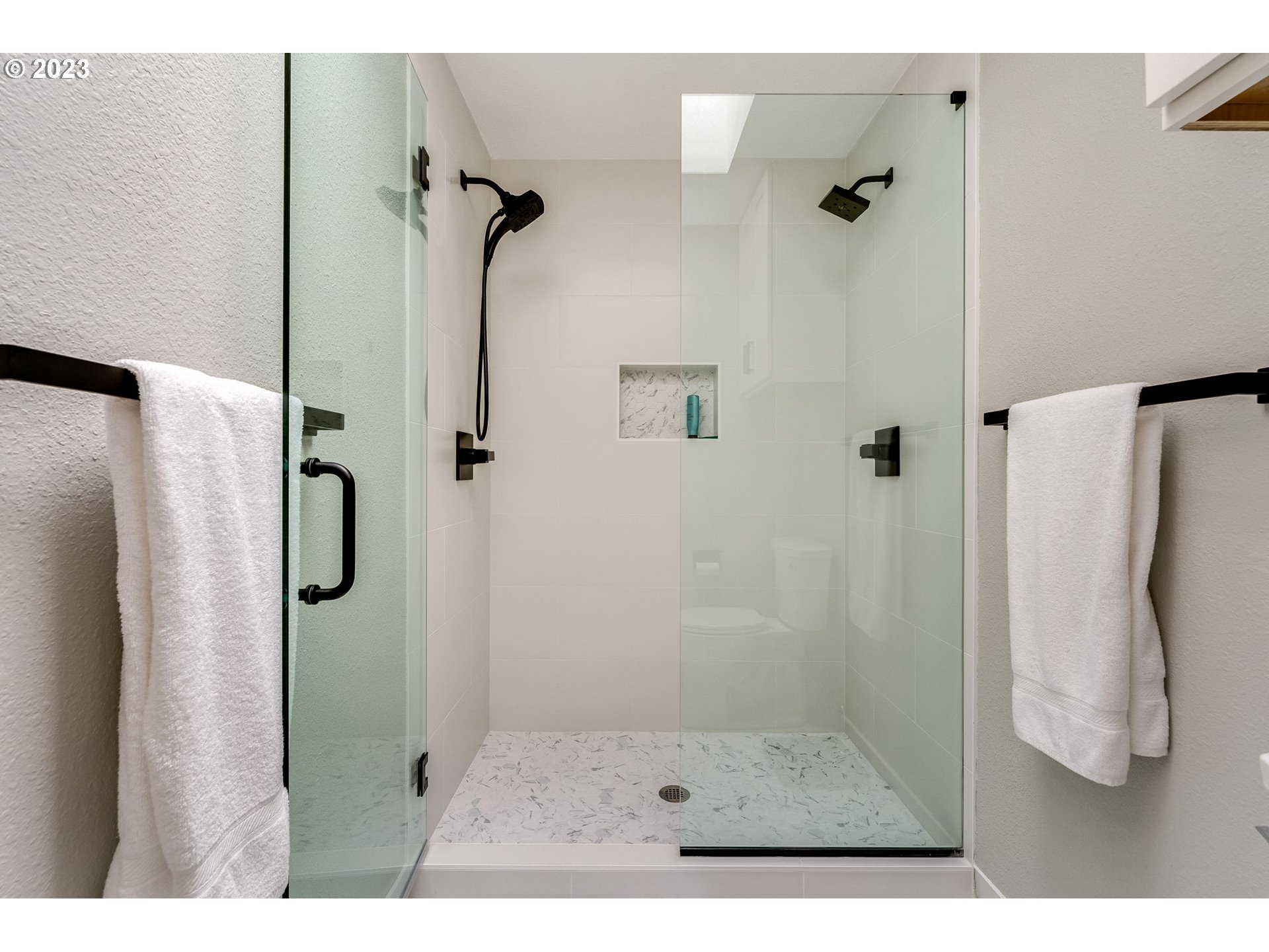 3200 Northeast Jackson Rd Loop Hillsboro, OR 97124 - Photo 32 of 37 a bathroom with a glass shower door