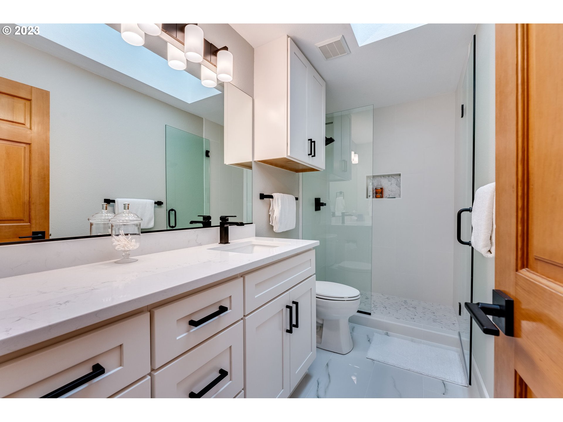 3200 Northeast Jackson Rd Loop Hillsboro, OR 97124 - Photo 33 of 37 a bathroom with a sink a toilet and a mirror